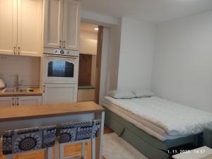 Ένα ή περισσότερα κρεβάτια σε δωμάτιο στο Apartman Fresh Jahorina