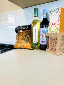 three bottles of wine sitting on top of a counter at The Hideaway in Scarborough