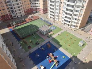 an aerial view of a tennis court in a city at 1 bedroom and living, Testemiteanu str. in Chişinău