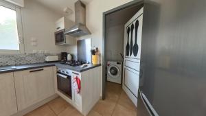 Kuchyň nebo kuchyňský kout v ubytování Charmante Maison entre Lot & Dordogne avec Piscine Privée