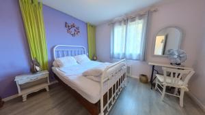 Llit o llits en una habitació de Charmante Maison entre Lot & Dordogne avec Piscine Privée