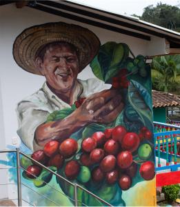 a painting of a man holding a bunch of fruit at Hosteria Los Alpes de San Roque in San Roque
