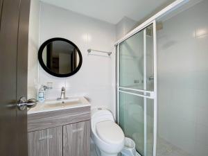a bathroom with a shower and a toilet and a sink at Mantilla living - 402 in Bucaramanga