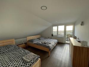Postel nebo postele na pokoji v ubytování Dětský svět nedaleko Kraví Hory + 13 fotografií