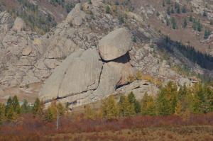 a large rock in the middle of a mountain at My Mongolia Eco Ger Camp in Nalayh
