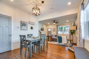 a dining room and living room with a table and chairs at Durham Vacation Rental 1 Mi to Duke University! in Durham