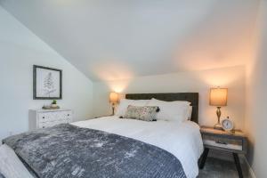 a bedroom with a large bed and two lamps at Durham Vacation Rental 1 Mi to Duke University! in Durham