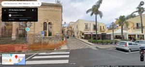 a view of a street with cars parked on the street at Casa con Giardino in Milazzo