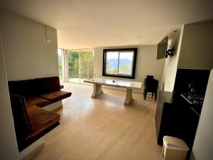 a living room with a couch and a table at Casa Campestre Villa de los Angeles in La Mesa