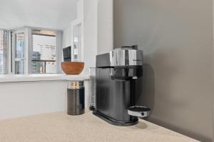 a coffee maker sitting on a counter in a kitchen at Downtown Luxury 1BR Coal Harbour in Vancouver