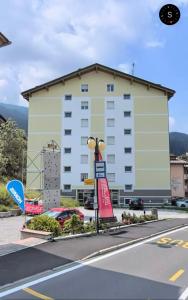 a large white building with a sign in front of it at Casa Anna - Andalo centrale sugli impianti da sci in Andalo