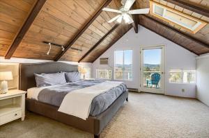 a bedroom with a large bed and a ceiling fan at Eastside Eden A Wine Country Escape in Healdsburg
