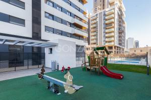 a playground on the roof of a building at SUPERB DÚPLEX with Pool & Garage in Valencia