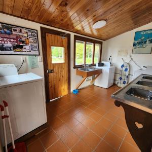 a kitchen with a sink and a counter top at Manapouri Holiday Park in Manapouri