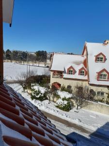 a house with snow on the roofs at Villa jouhara in Ifrane