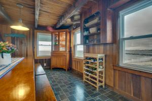 a wine cellar with wooden walls and windows at Historic Cottage w/ Beautiful Oceanfront View in Marshfield