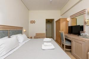 Hotel Timoleon客房内的一张或多张床位