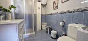 a small bathroom with a toilet and a sink at Altillo Vista Mar in Moya