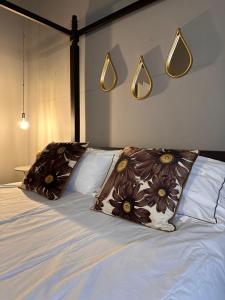 a bedroom with a bed with two pillows on it at Botta 9 in Bergamo
