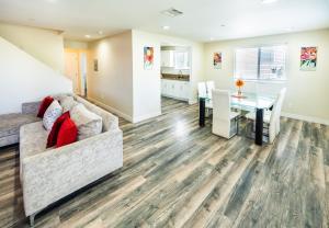 a living room with a couch and a table at Large chic 5-bedroom 3 bathroom clost to Downtown LA in Los Angeles +23 photos