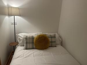a teddy bear sitting on top of a bed at Chic Citispace -1-Bed Apartment Leeds City-WiFi in Leeds