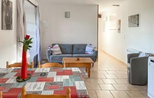 a living room with a couch and a table at Manoir Les Touches 