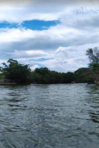 a view of a river from a boat at Pousada das Colonias Ilha da Gijóia in Barra da Tijuca