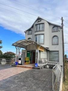 a large building with a porch in front of it at Luxury apartment in Bitola +41 photos