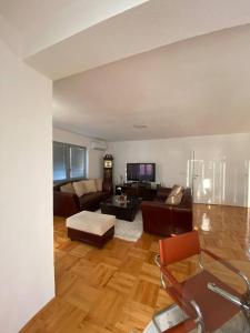 a living room with a couch and a table at Luxury apartment in Bitola