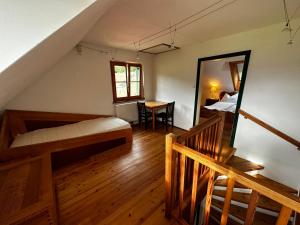 a bedroom with a bed and a mirror in a room at Ferienhaus Prettenthaler in Gaal