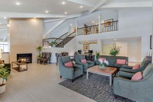 a large living room with couches and a fireplace at Best Western Plus Executive Inn in Rowland Heights