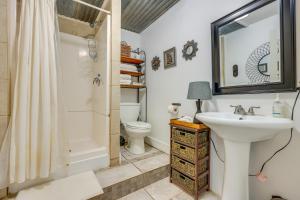 a bathroom with a sink and a toilet and a shower at Bohemian New Braunfels Home with River Access! in New Braunfels +24 photos