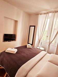 A bed or beds in a room at Brera