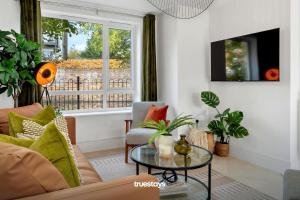 a living room with a couch and a table at NEW Canalside House / 3 Bedroom House in Stoke-on-Trent in Stoke on Trent