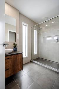 a bathroom with a glass shower and a sink at Mt Duneed Retreat in Mount Duneed