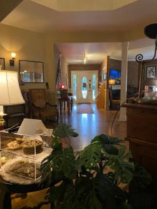 a living room with a table with food on it at The Currier Inn in Greeley