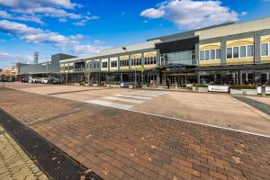 an empty street in front of a building at Tuggeranong Short Stay #10C - Sleeps 6 in Canberra +35 photos
