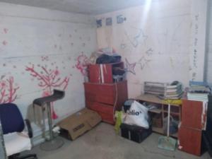 a room with a pile of boxes and a desk at דירת אירוח בית שיאים in Beer Sheva