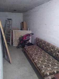 a room with a bed and a stroller in it at דירת אירוח בית שיאים in Beer Sheva