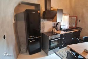 Η κουζίνα ή μικρή κουζίνα στο Mani Tu 2 - Exclusive Ocean Sea View & Tranquility