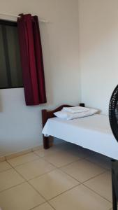 a room with a bed with a plate on it at Flat Japaratinga Beach in Japaratinga