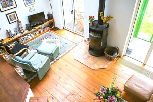 an aerial view of a living room with a fireplace at One bedroom house with lake view and enclosed garden at Tourmakeady/Derrypark in Finny