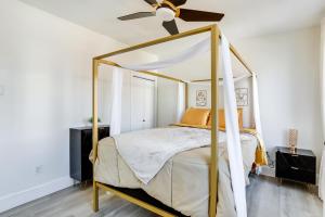 a bedroom with a canopy bed with a ceiling fan at Philadelphia Vacation Rental about 4 Mi to Center City in Philadelphia