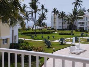 a view from the balcony of a resort at Oceanfront Playa Turquesa with highspeed Wi-Fi, pools, free beach access in Punta Cana