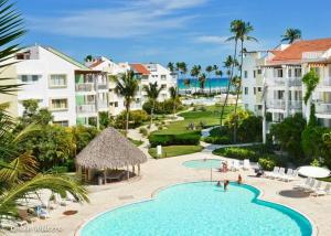 an aerial view of a resort with a swimming pool at Oceanfront Playa Turquesa with highspeed Wi-Fi, pools, free beach access in Punta Cana