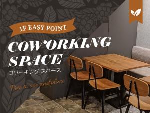 a table and chairs in a restaurant with the words if easy point computing space at HOTEL SUI AKASAKA by ABEST in Tokyo