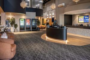 a lobby with a waiting area with a counter in it at Fairleys of Corowa in Corowa