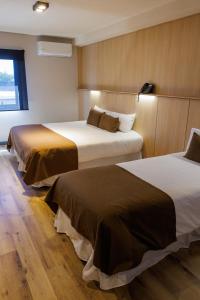 Cama ou camas em um quarto em Fuente Mayor Hotel Terminal