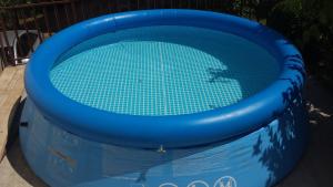 a blue inflatable swimming pool in a yard at Villa Ana Marija in Duračka Reka