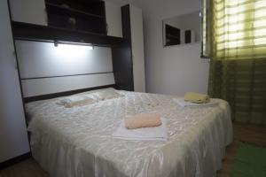 Postel nebo postele na pokoji v ubytování "Azzurra Apartments